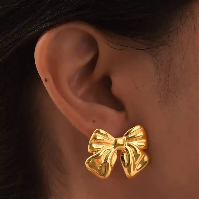 Golden Bow Glam Ørestik – Forgyldt Sløjfe i Elegant Design